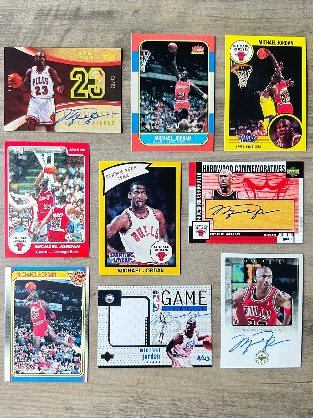 Michael Jordan Signed Rookie Lot of (9) Star Fleer Upper Deck Novelty Cards.